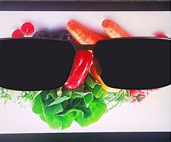 Display viewed through sunglasses with blackout